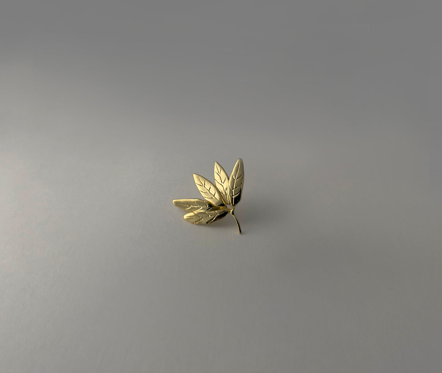  Leaf Cluster gold earrings - close-up showing engraved leaf veins and layered fan-like form | HELIGRAE handcrafted jewelry