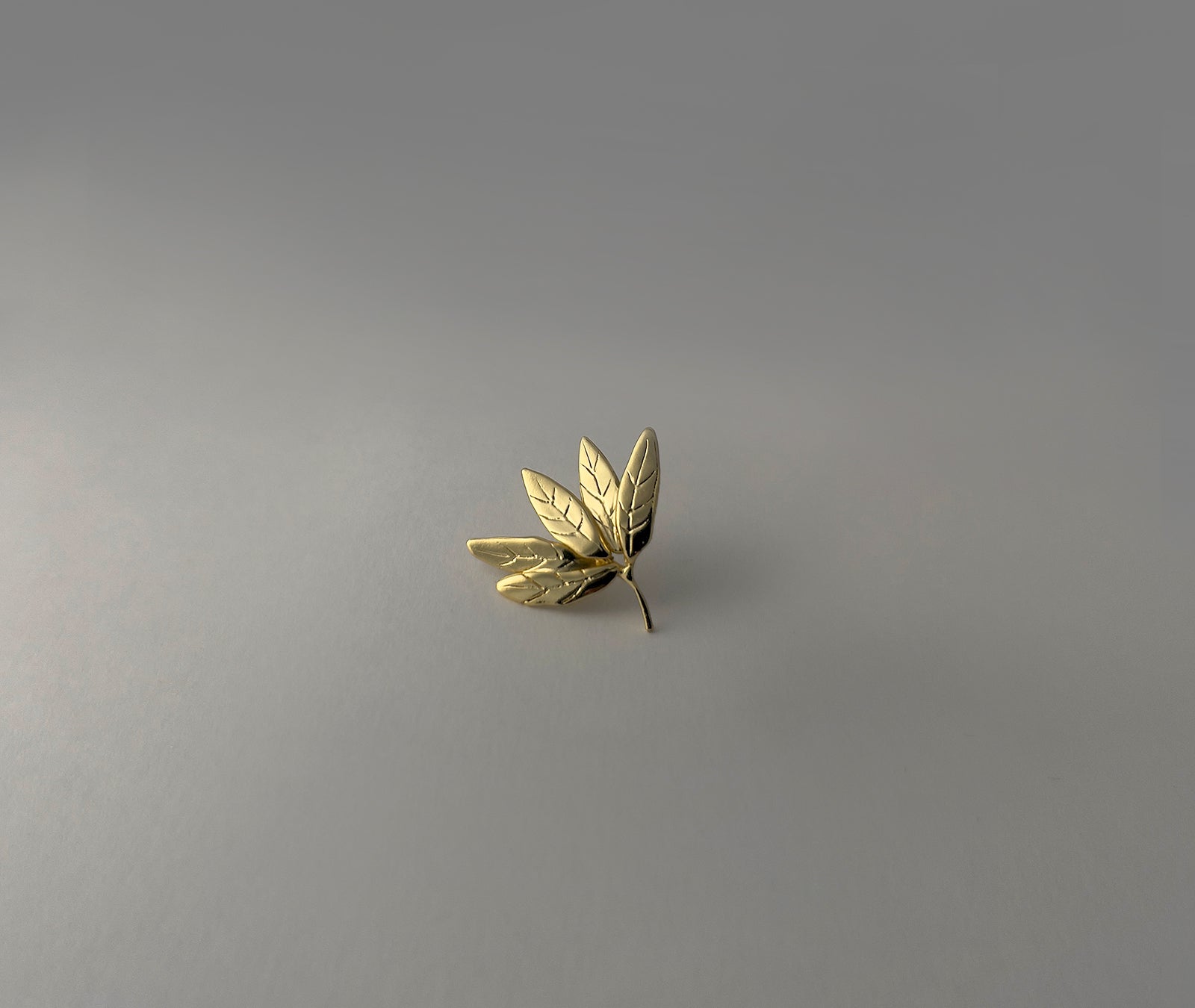  Leaf Cluster gold earrings - close-up showing engraved leaf veins and layered fan-like form | HELIGRAE handcrafted jewelry
