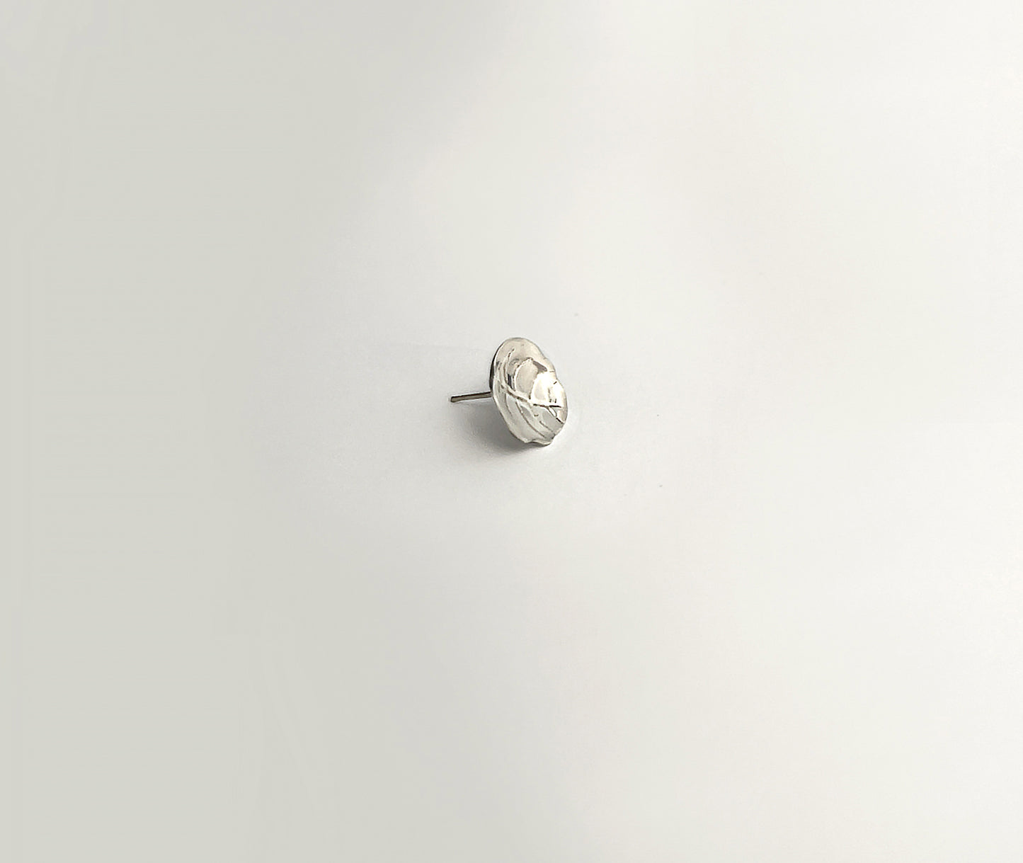 Minimalist Leaf earrings - detailed view of softly curved leaf shape with natural texture | HELIGRAE 925 silver