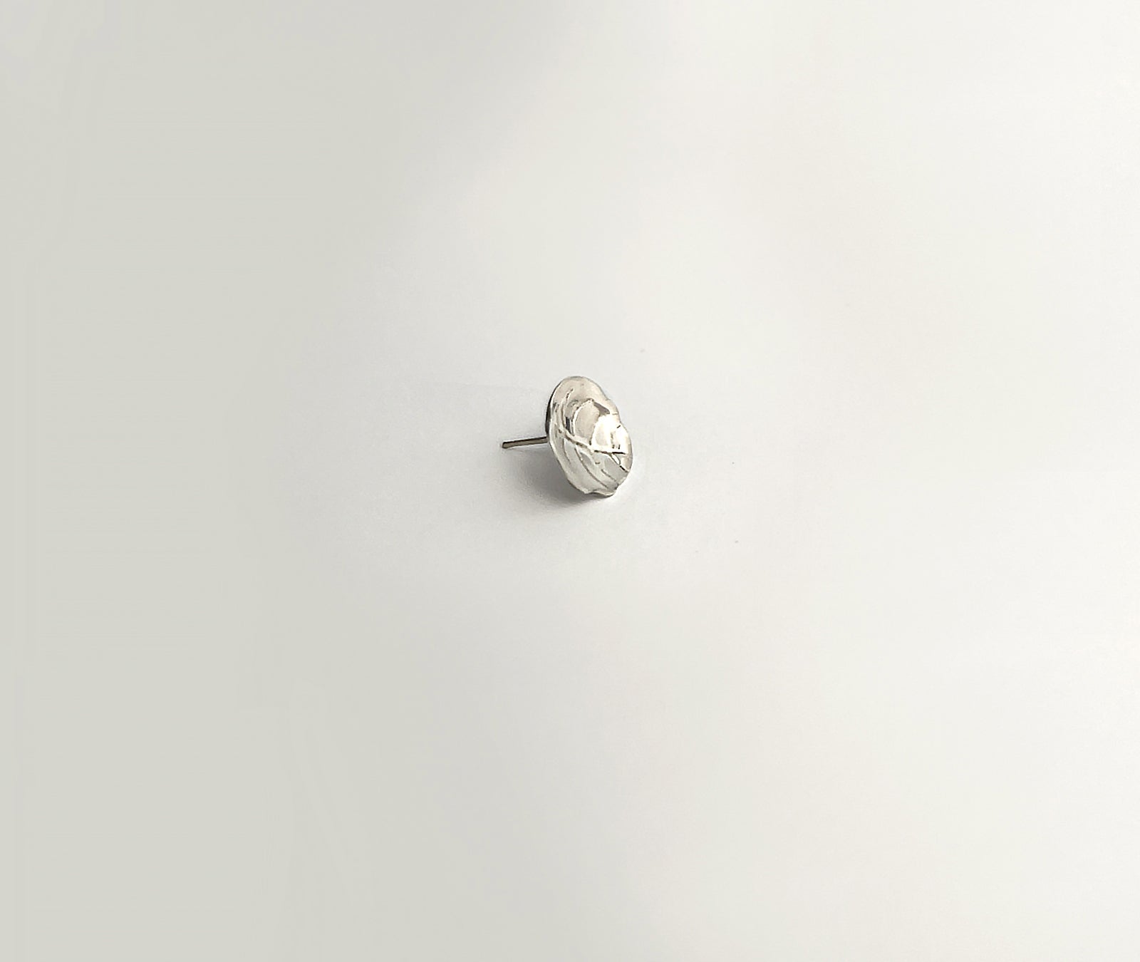 Minimalist Leaf earrings - detailed view of softly curved leaf shape with natural texture | HELIGRAE 925 silver