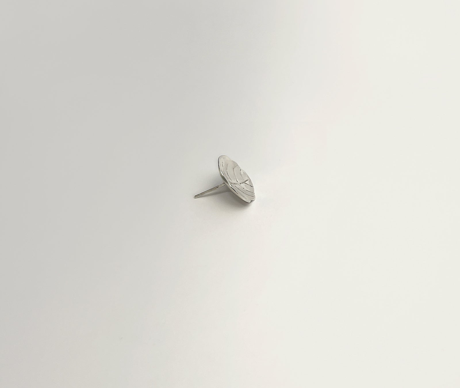  Minimalist Leaf silver studs - side angle highlighting dimensional depth and refined thickness | HELIGRAE Prototype 09