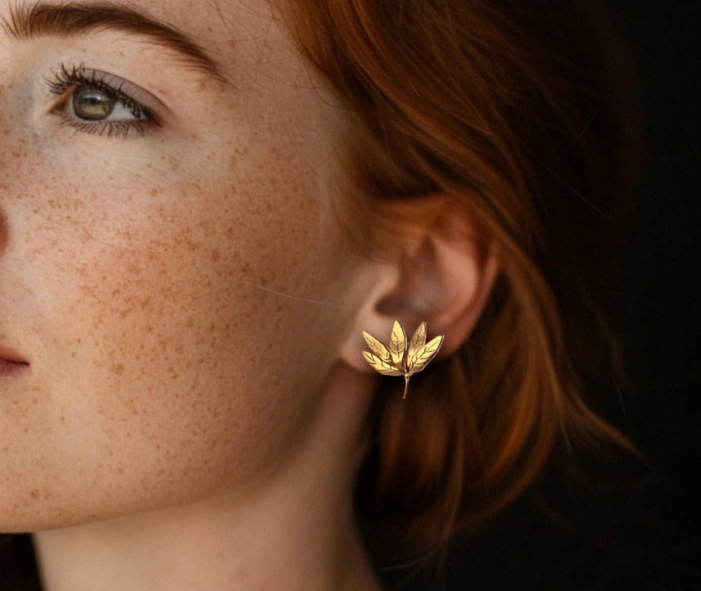 Leaf Cluster gold earrings - lifestyle shot showing elegant statement design for work and everyday wear | HELIGRAE minimal jewelry
