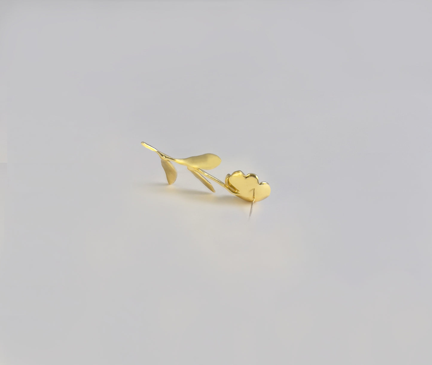 Handcrafted botanical earrings - side angle showing dimensional form