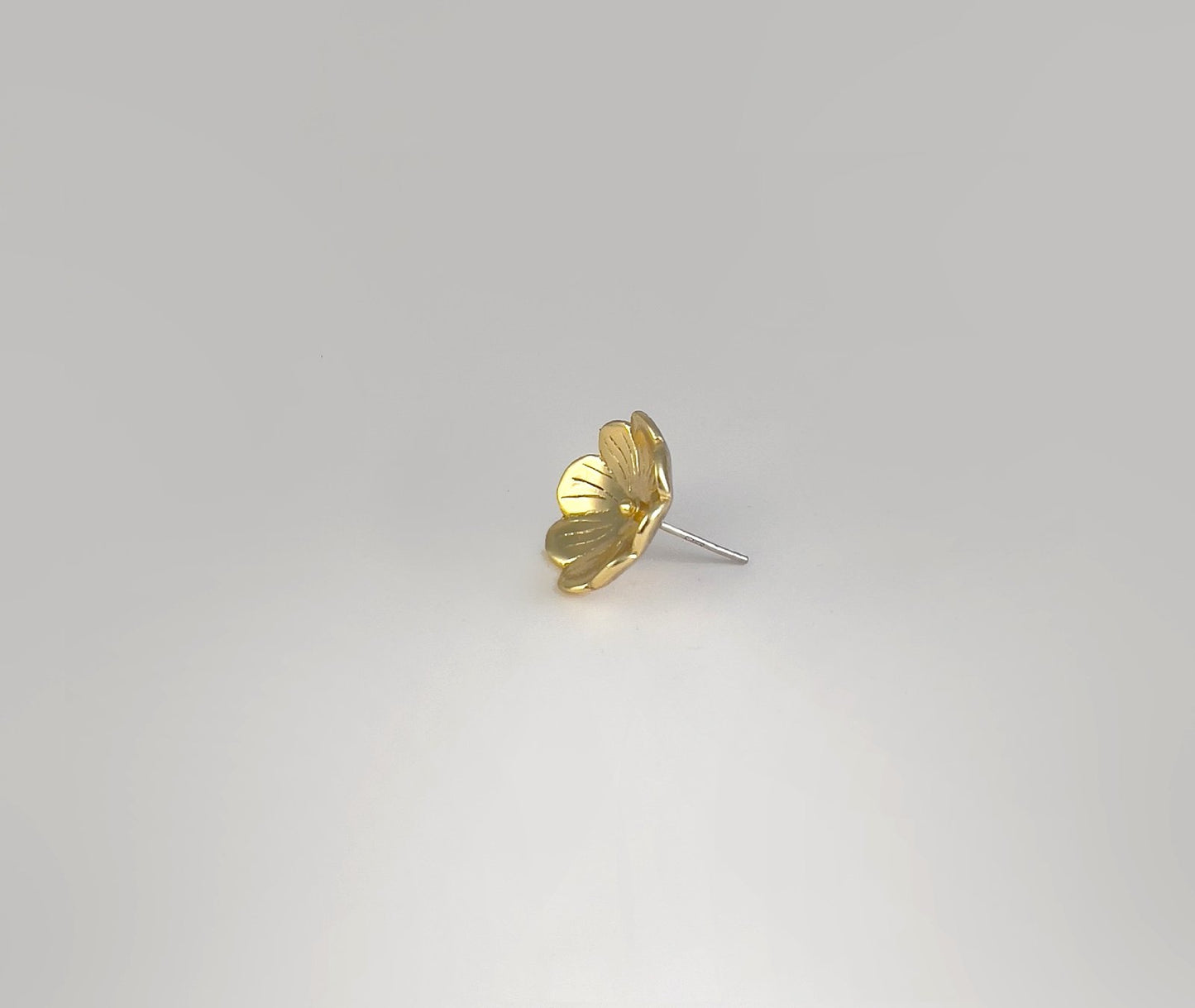 Morning Dew Bloom floral studs in gold - side angle highlighting layered petal structure and radiant finish | HELIGRAE 18K gold plated