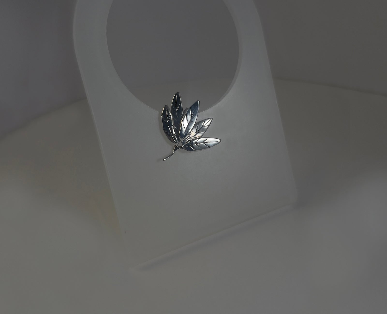 Leaf Cluster silver studs - side angle highlighting dimensional botanical cluster design | HELIGRAE 2026 Collection
