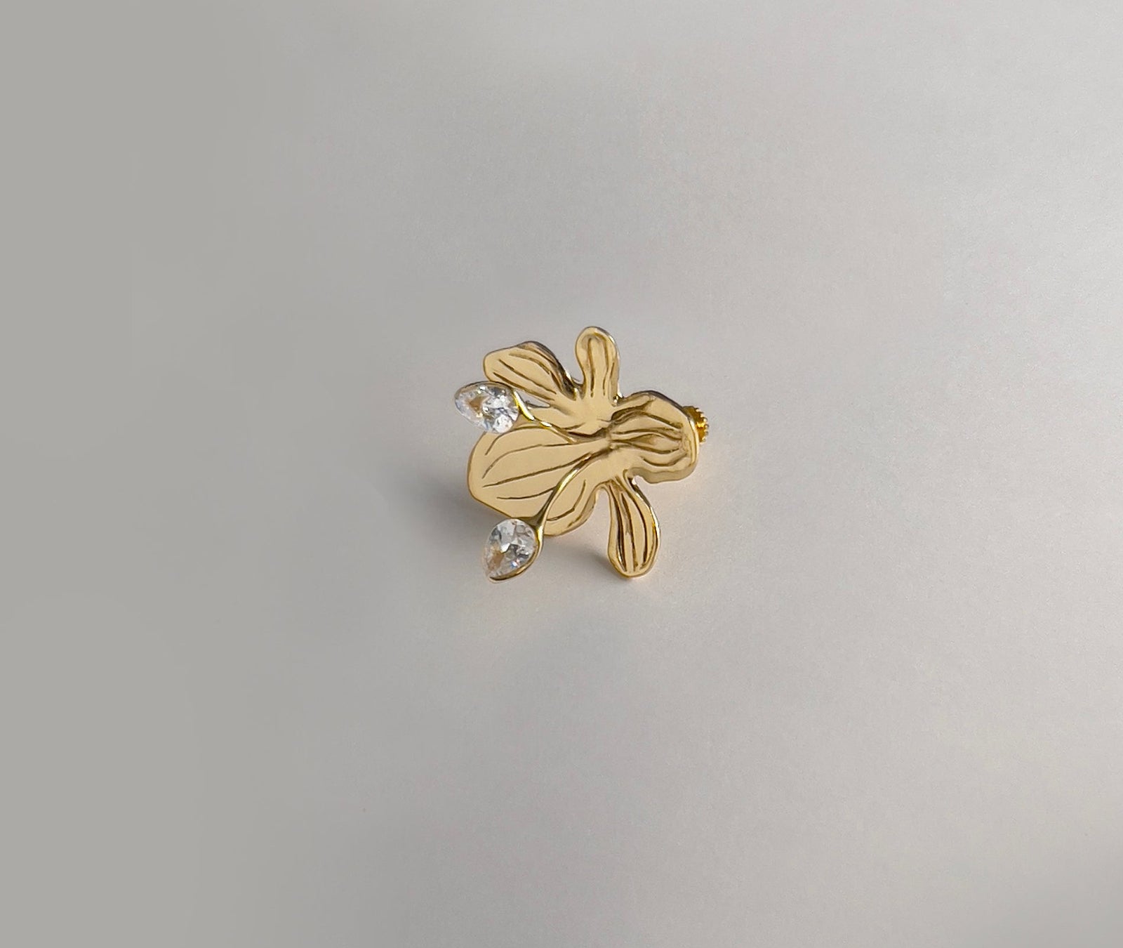 Orchid Bloom gold earrings - close-up showing sculptural petals and curved stamen details | HELIGRAE handcrafted jewelry