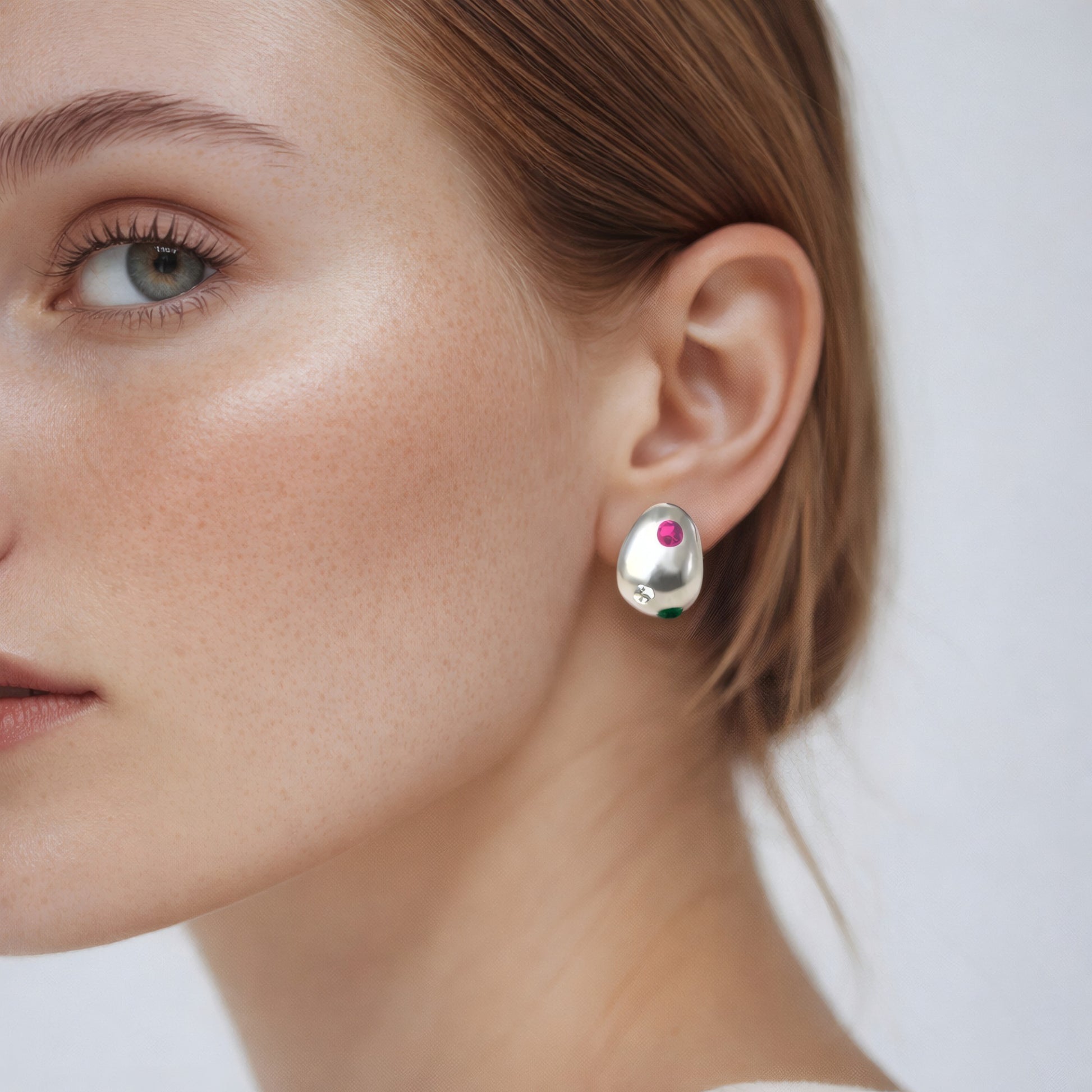 Minimal Pebble Stud Earrings styled on ear with modern minimalist look