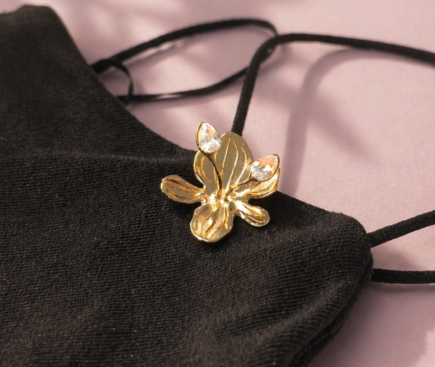 18K gold orchid earring with crystal gems, lifestyle shot