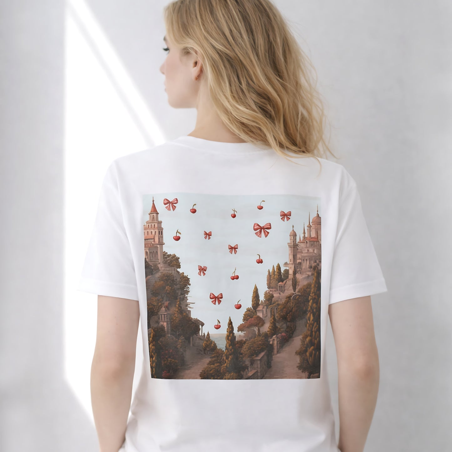 model wearing white cherry castle back print graphic t-shirt