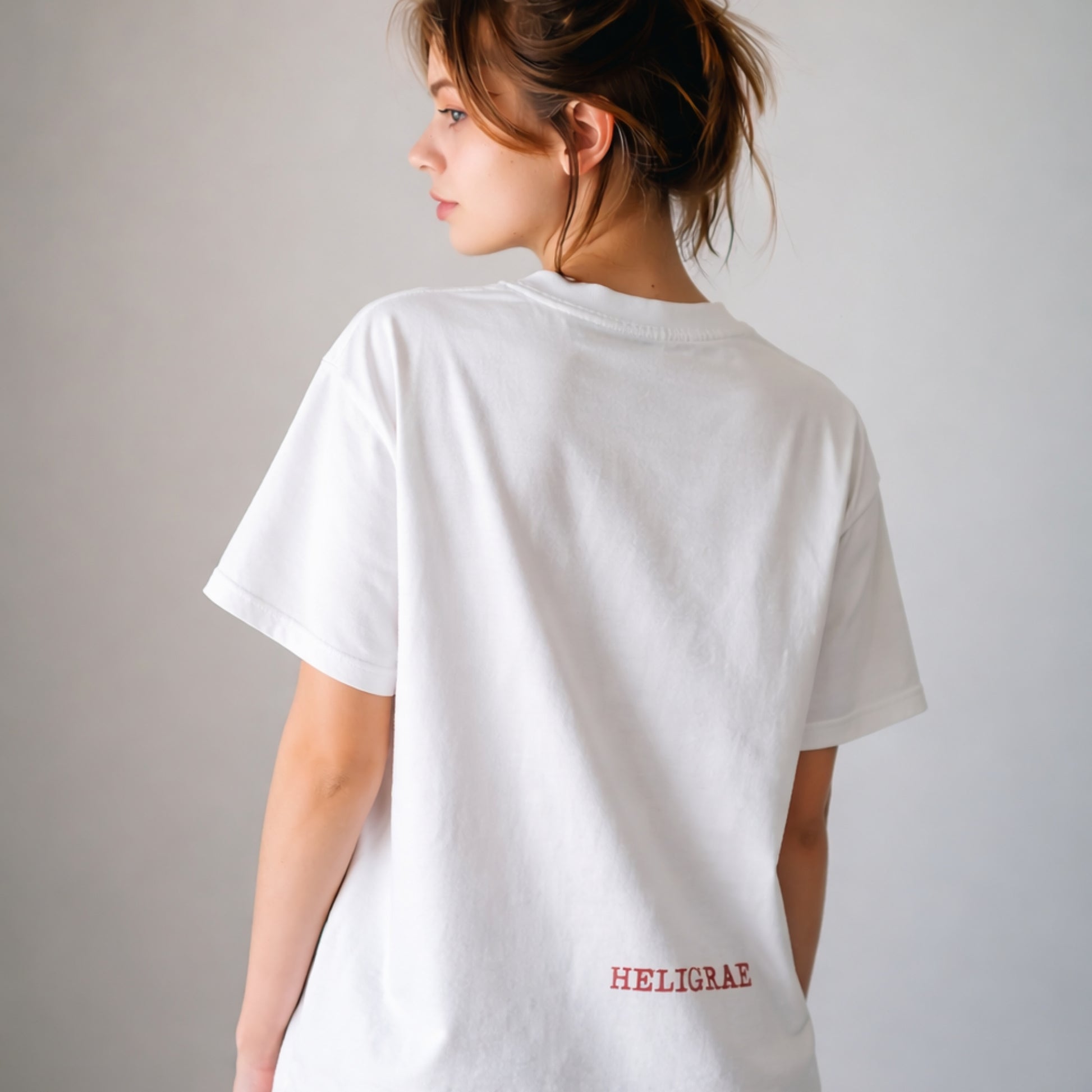model wearing white t-shirt back minimal logo design